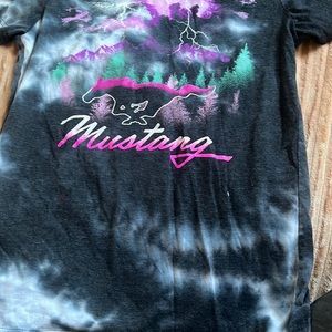 His is a small guys shirt from ford